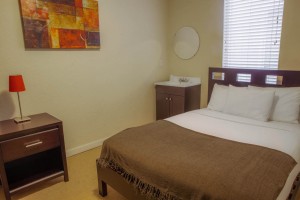 1 Queen Bed Shared Bathroom
